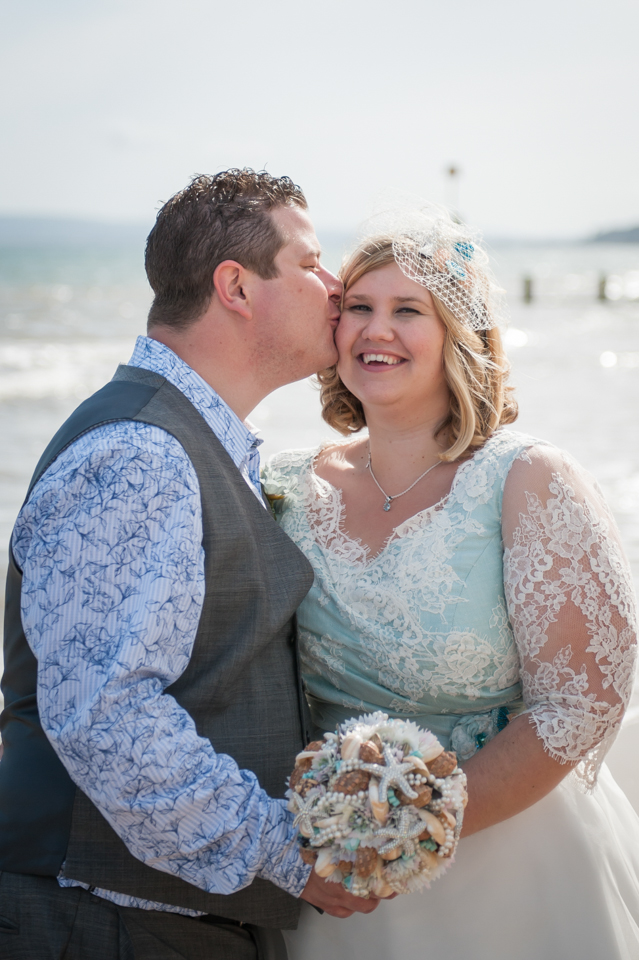Natalie's aqua toned alternative beach wedding with shell and starfish  accents 